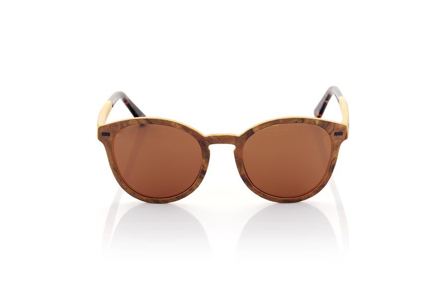 Wood eyewear of Burr LUAI. LUAI wooden sunglasses are an exceptionally elegant model, with a frame and temples made of Burr laminated wood on the outside and beige maple on the inside, giving it a unique marbled look. The temples are finished in acetate and are adjustable, allowing for a comfortable and secure fit. With its rounded shape, these glasses are versatile and adapt to any style and gender. Solid lenses offer exceptional protection from the sun's rays, while their classic styling ensures you'll always be in style. With Luai sunglasses, you will enjoy the sun in style and with superior protection. Front measurement: 141x51mm Caliber: 50 for Wholesale & Retail | Root Sunglasses® 